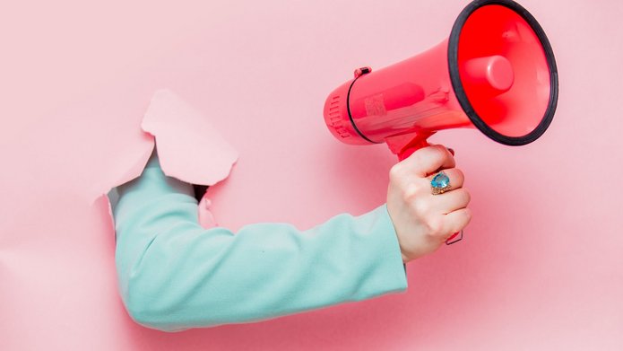 Female hand in classic blue jacket with megaphone Element dekoracyjny